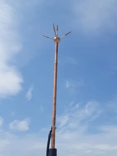 Lightning arrester installed against a blue sky